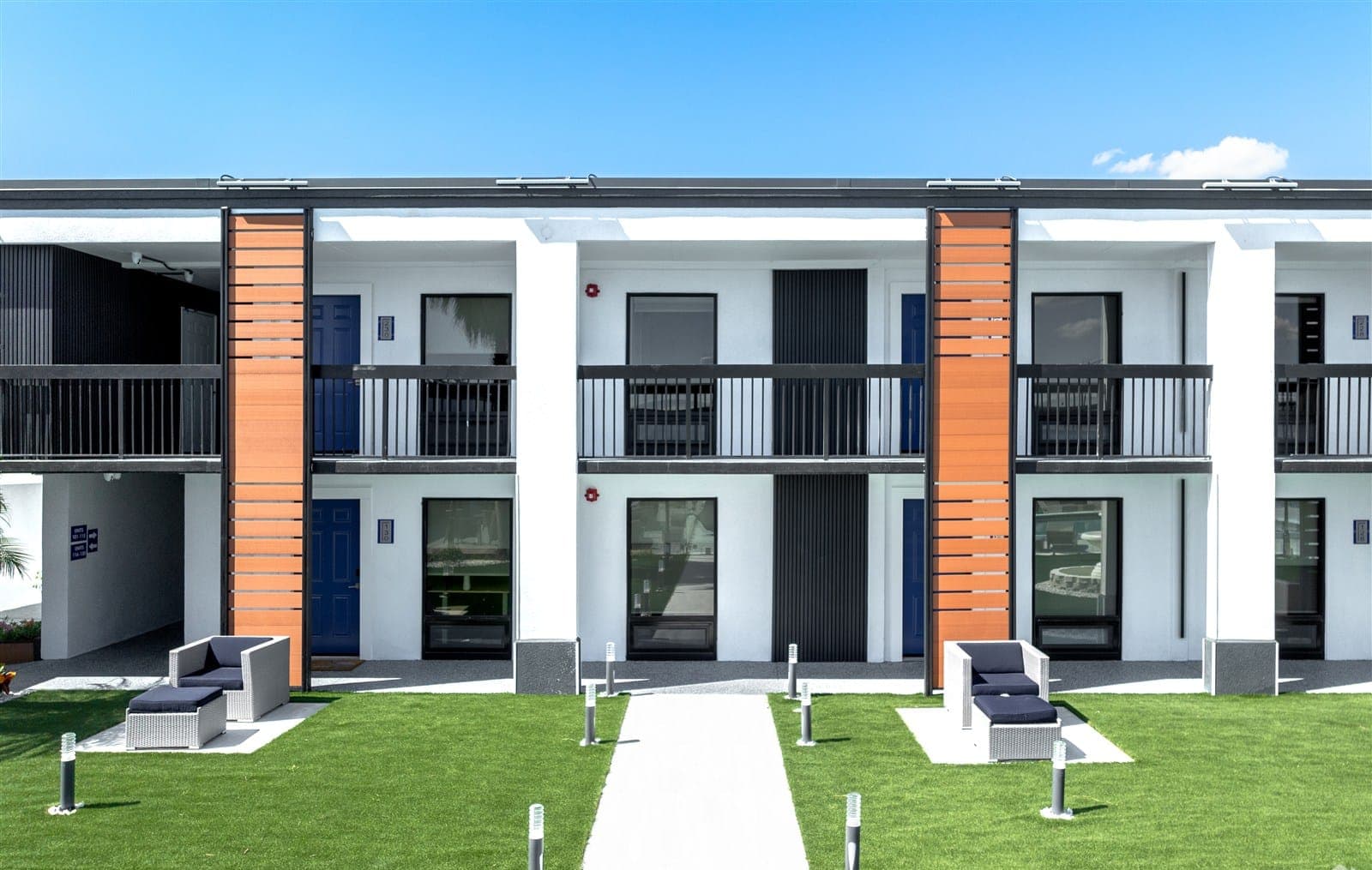 The homes at The Jade seen across the lawn, balconies and entries in a row